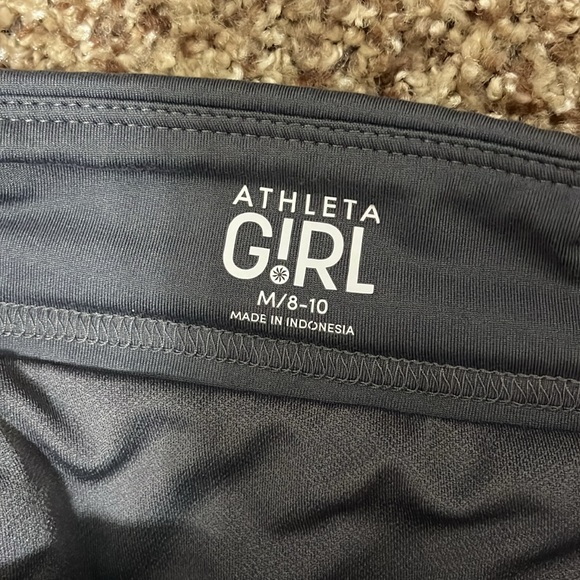 2 pairs (grey and black) size medium (8-10) athleta girl shorts. - Picture 4 of 11